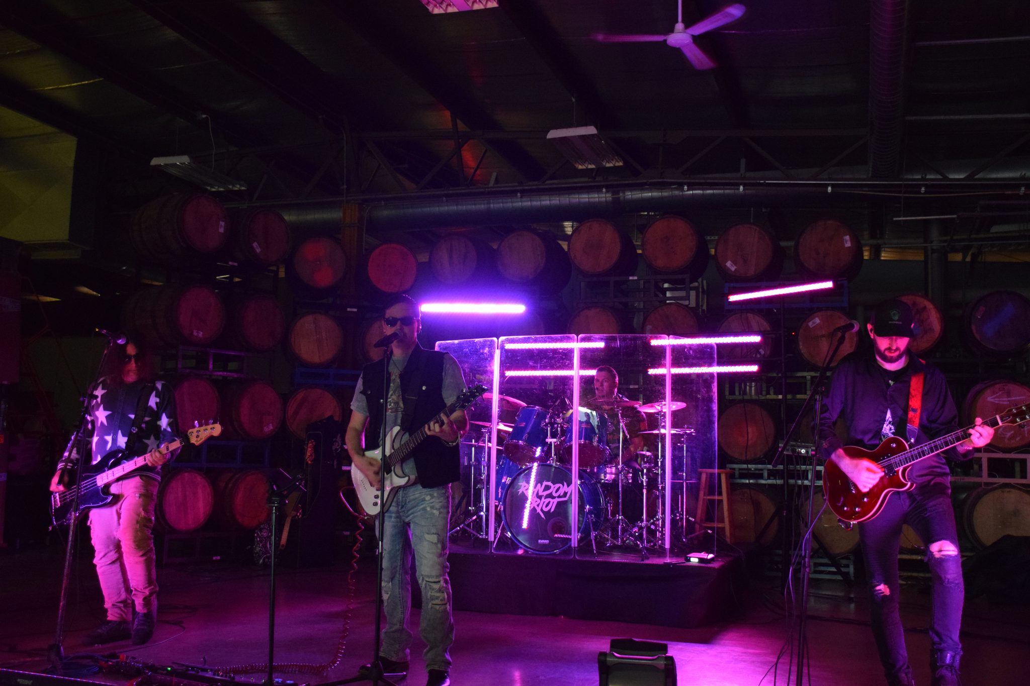 Random Riot performing live, the full five-piece lineup on stage