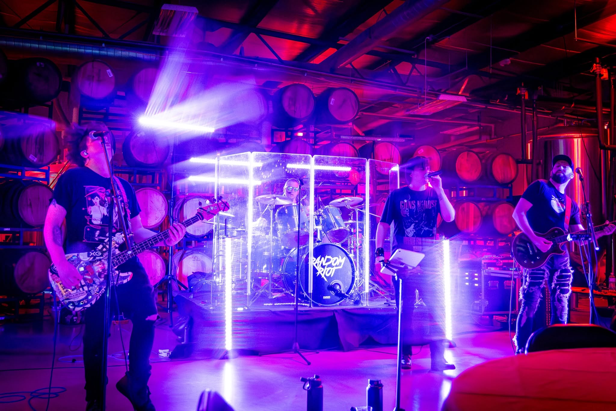 Random Riot performing live, the full five-piece lineup on stage