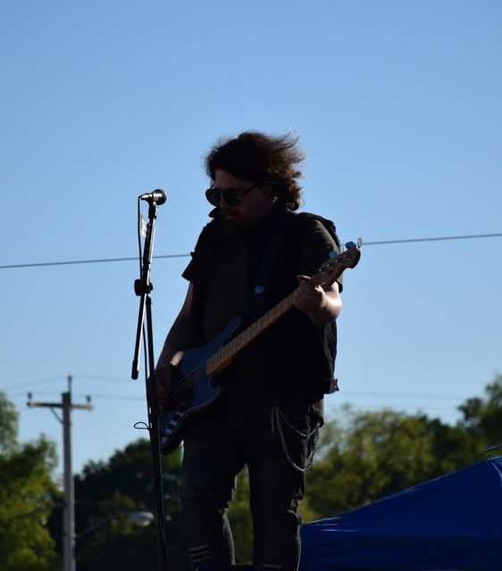Guitarist playing outdoors in the late afternoon light